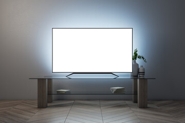 Illuminated white TV screen with furniture on concrete wall background. Television concept. Mock up, 3D Rendering.