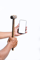 A man is breaking a smartphone with a big hammer