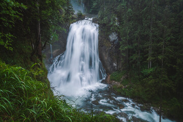 Fototapeta na wymiar The Gollinger waterfall in Austria on rainy day