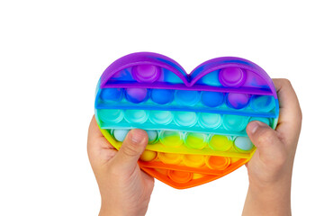 Popular children's toy pop it for fine motor skills. colorful antistress sensory toy fidget push pop it in kid's hands.