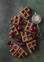 Homemade chocolate waffles with berries and chocolate ice cream. Delicious dessert or breakfast.