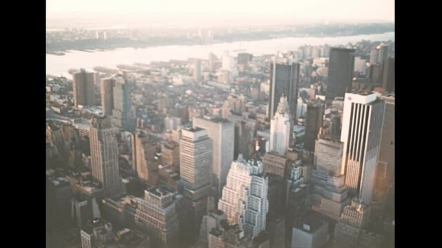 Manhattan aerial view on streets of New York city with historic 1900s buildings at sunset. Archival skyline of New York aerial view in 1970s. Vintage United States of America in 1976.