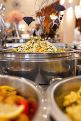 a pot of rice and vegetables in a cafe.