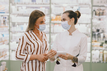 Woman pharmacist checking medicine in pharmacy