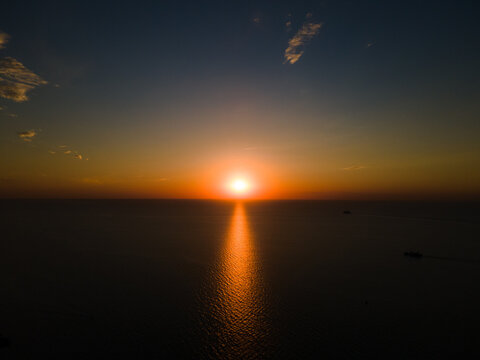 Bird's-eye view of the sunset on the city beach. Black Sea.