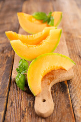 melon slices on wooden board