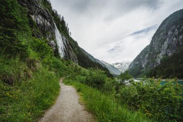 Hiking trail around Stillup Lake with mountain alpine waterfalls around Austria, Tyrol