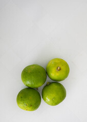 Group of fresh limes on white background
