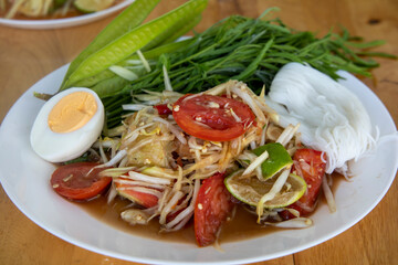 Thai spicy green papaya salad Som Tam Korat
