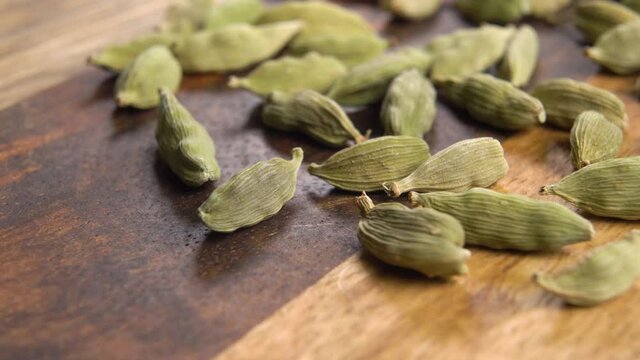 Green dry cardamom seeds. Macro