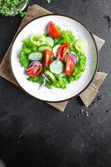 salad vegetable tomato, cucumber, pepper, onion, lettuce meal snack copy space food background rustic. top view