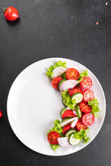 salad vegetables cucumber, tomato, onion, lettuce food organic products meal snack copy space food background rustic. top view keto or paleo diet veggie vegan or vegetarian food