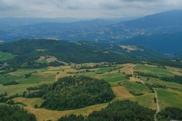 Aerial view of landscape with fields, mountains, woods, and blue sky. natural background. 