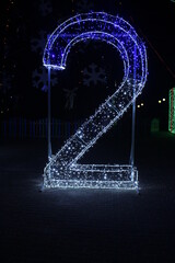 Number 2 two blue white and garlands of lighting. New Year Christmas Illumination Symbol of the...