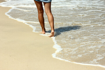 footprints in the sand on the beach