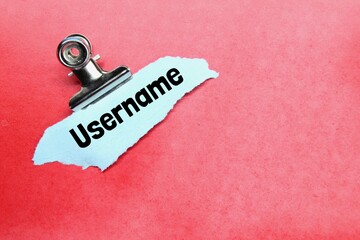 torn paper, clamps with the word username