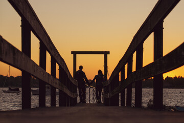 Holding hands at sunset