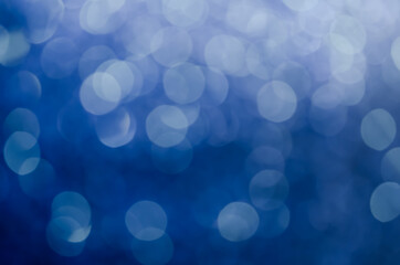 abstract blue bokeh glitter sparkle background.