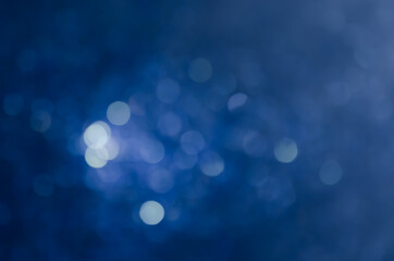 abstract blue bokeh glitter sparkle background.