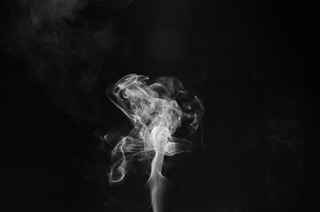 abstract fragment movement of white smoke on black background.