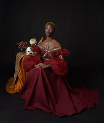 Classical  portrait of pretty African woman wearing red renaissance medieval fantasy gown,  shadowy...