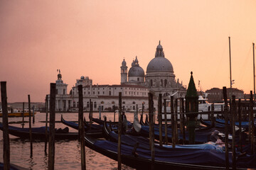 the sunset in venice with its gondolas