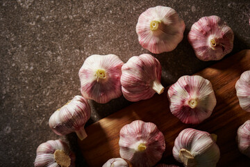 fresh garlic on wooden chopping board