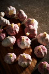 fresh garlic on wooden chopping board