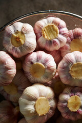Garlic washed in water in a pot