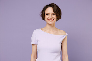 Young cheerful smiling happy caucasian stylish brunette woman 20s with bob haircut wearing white t-shirt looking camera isolated on pastel purple background studio portrait. People lifestyle concept