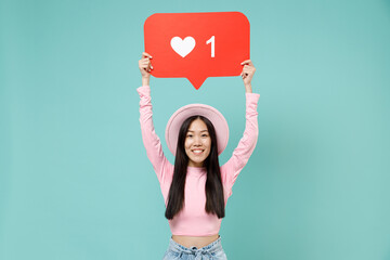 Satisfied charismatic stunning young brunette asian woman 20s wears pink clothes hold above head huge like sign from social network heart form isolated on pastel blue color background studio portrait
