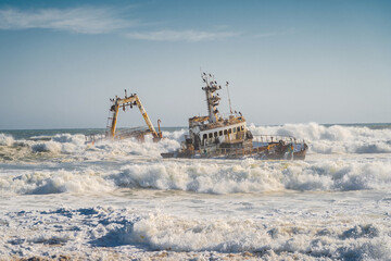 Waves crashing on Zeila Shipwreck near Henties Bay on the Skeleton Coast in Namibia, Africa. 