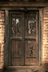 Fototapeta na wymiar old vintage wooden door on retro wall, Wafgaon, India.