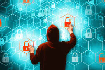 Person in a hoodie is hacking computer networks security.