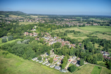 Fototapeta na wymiar Bramber village aerial with Bramber Castle and St Nicholas Church in the countryside of West Sussex.