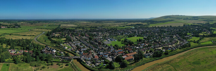 Fototapeta na wymiar Aerial panoramic photo over Bramber village and the countryside of West Sussex and the South Downs.