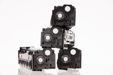 Fototapeta premium Four used laser printer toner cartridges isolated white background.