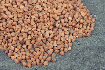 Heap of buckwheat containing vitamins and dietary fiber. Healthy nutrition