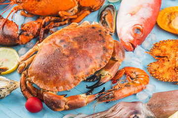 Seafood dinner, seafood dinner with fresh lobster, crab, mussel and oyster as background