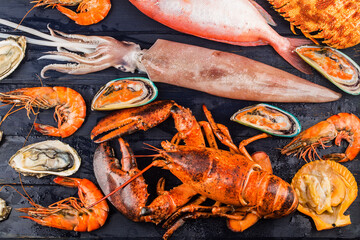 Seafood dinner, seafood dinner with fresh lobster, crab, mussel and oyster as background