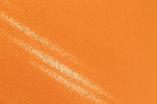 Real Natural Rays Of Sunlight On Orange Wall