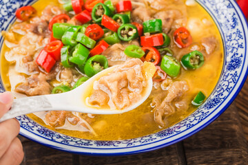 A delicious Chinese Cantonese dish with beef in golden soup