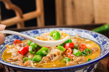 A delicious Chinese Cantonese dish with beef in golden soup