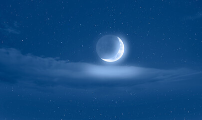 Night sky with crescent bright moon in the clouds, blue sea in the foreground "Elements of this image furnished by NASA"