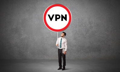 Young business person holdig traffic sign