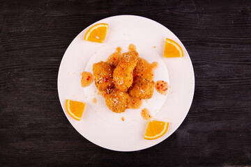 fried chicken, orange, sesame, sauce, served with steam rice