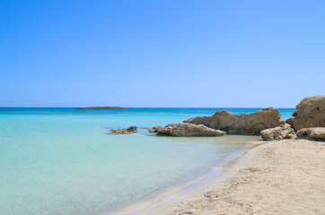 Rocky stones on a paradise sandy shore.