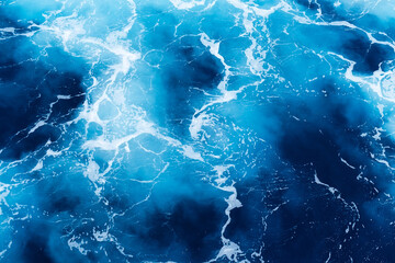 Waves and blue water as a background. View at the ocean surface. Natural summer seascape. Water...