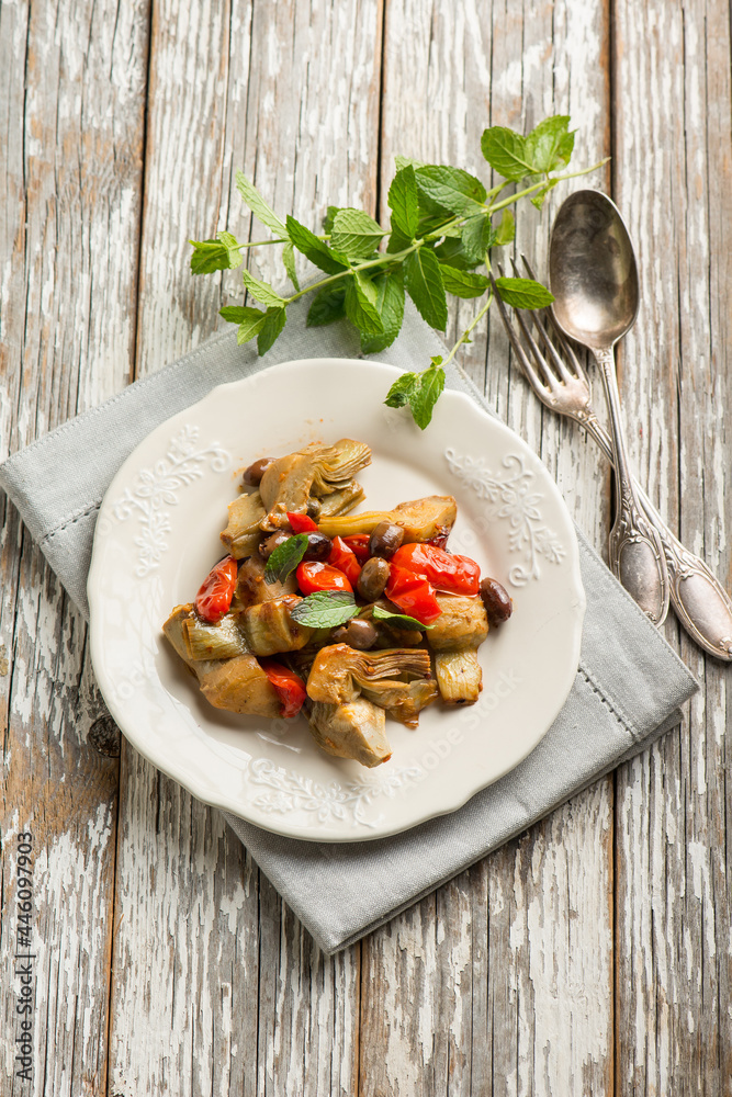 Poster artichoke tomatoes and black olives salad