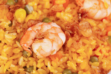 fried rice with shrimp, fries, corn, peas, carrots, squid